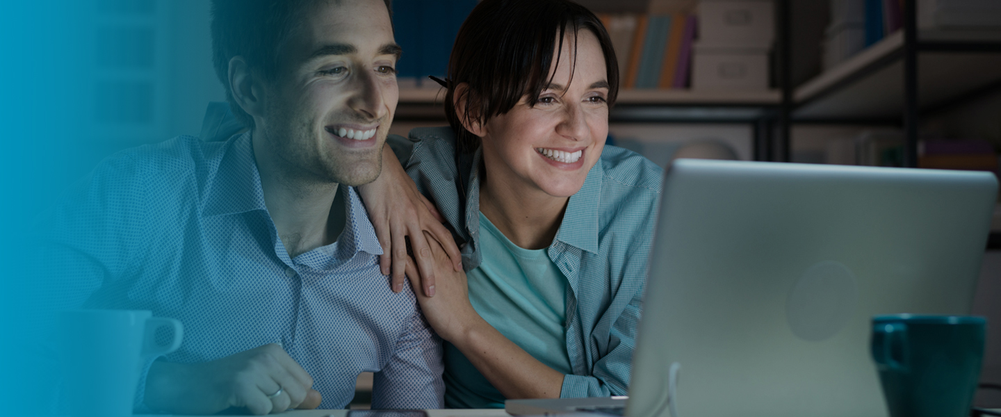 Picture of couple using internet at home