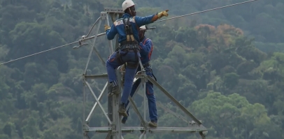 Technicians operating on power line