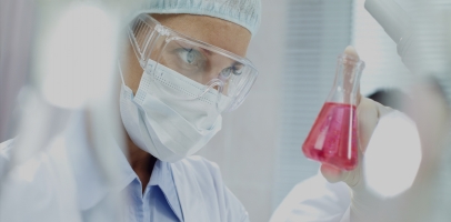 Photo of chemist in controlled environment